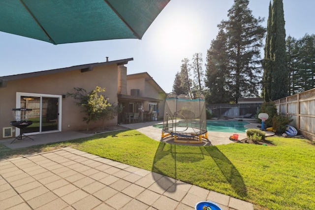 exterior space featuring a fenced in pool and a patio area