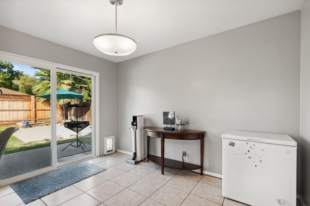 doorway with light tile patterned floors