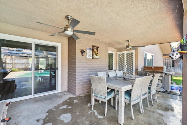 view of patio / terrace with ceiling fan and grilling area