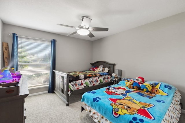 bedroom with ceiling fan and light colored carpet