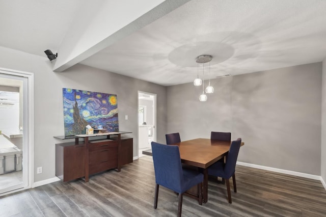 dining space with dark wood-type flooring