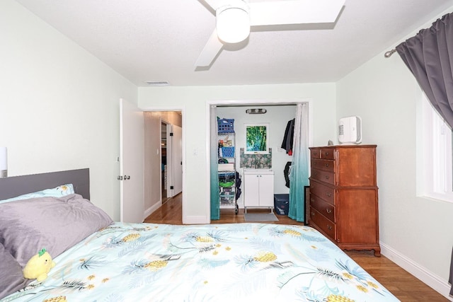 bedroom featuring hardwood / wood-style floors and ceiling fan