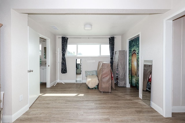 unfurnished room featuring light wood-type flooring