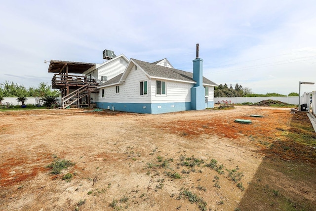 view of side of property featuring cooling unit