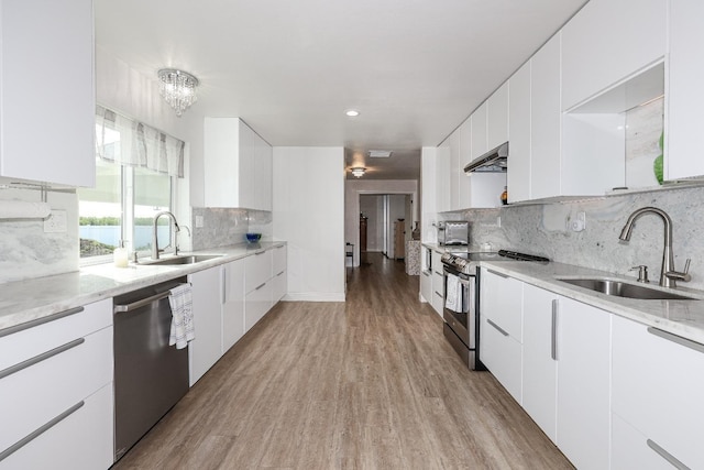 kitchen featuring sink, white cabinets, and appliances with stainless steel finishes