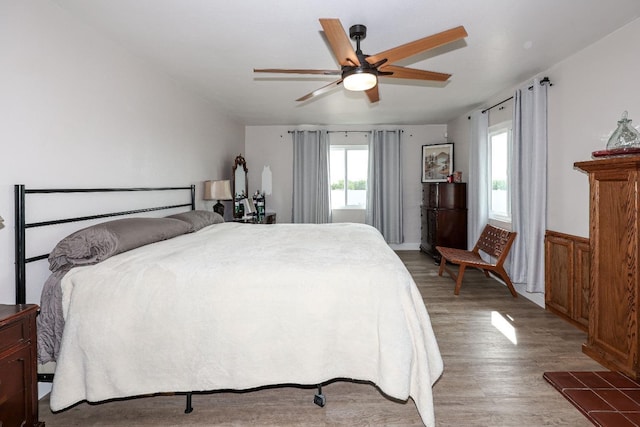 bedroom featuring hardwood / wood-style floors and ceiling fan