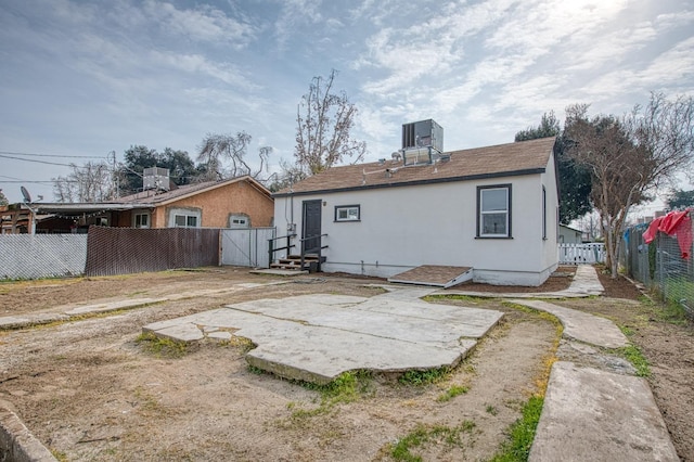 rear view of property featuring a patio