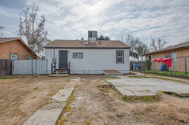 back of property with cooling unit