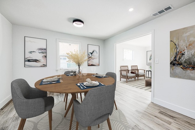 dining area with light wood-type flooring