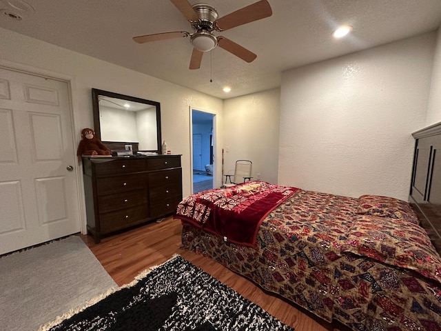 bedroom featuring ceiling fan and light hardwood / wood-style flooring