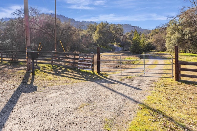 view of gate featuring a rural view