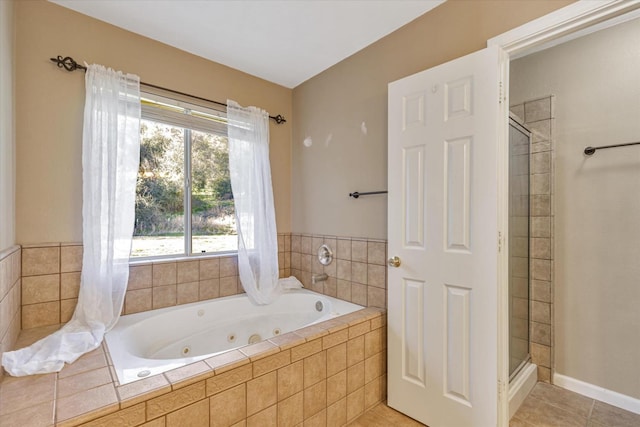 bathroom featuring tile patterned floors and shower with separate bathtub