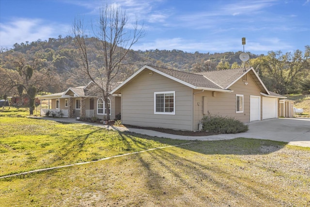 view of front facade with a garage and a front lawn