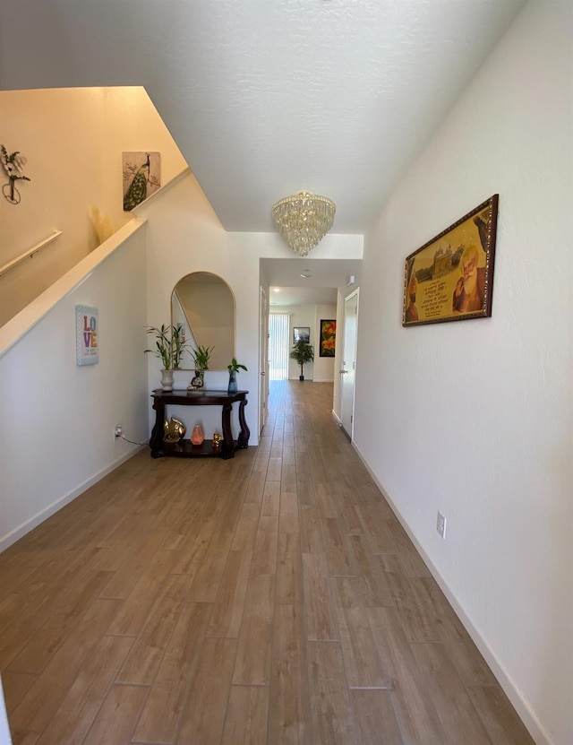 corridor with hardwood / wood-style floors