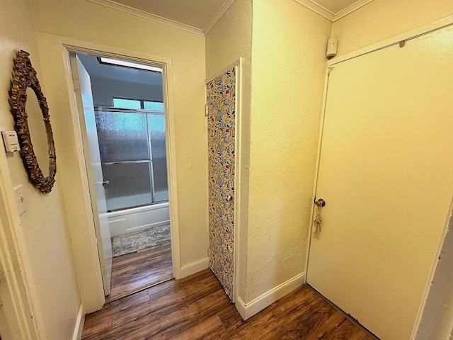 corridor featuring crown molding and dark hardwood / wood-style floors