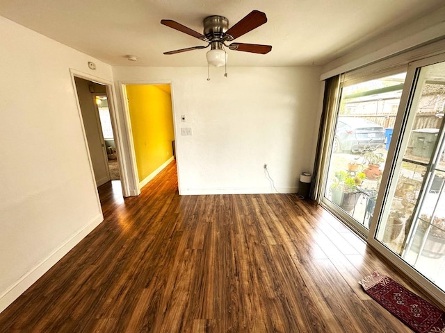 unfurnished room featuring ceiling fan and dark hardwood / wood-style flooring