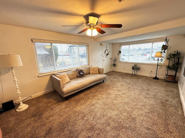 unfurnished room featuring plenty of natural light, carpet, and a textured ceiling