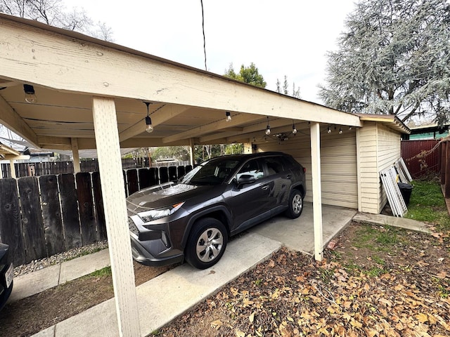 view of vehicle parking with a carport