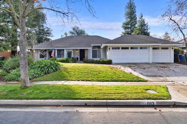 ranch-style home featuring a garage and a front lawn