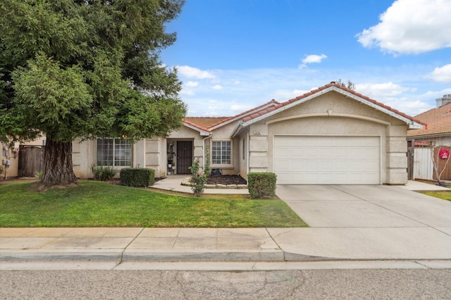 ranch-style house with a garage and a front yard