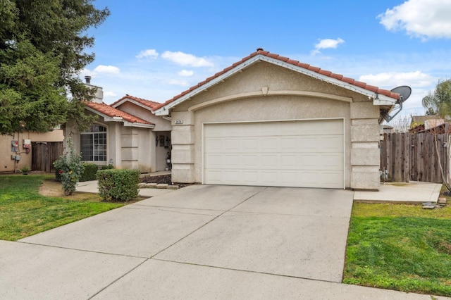 single story home featuring a garage and a front yard