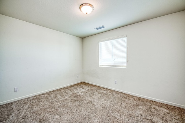 empty room with carpet flooring