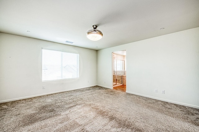 view of carpeted spare room