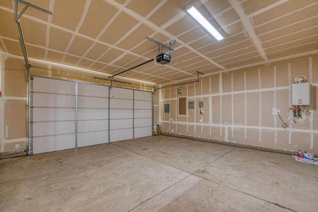 garage with a garage door opener and tankless water heater