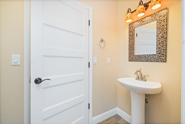 bathroom with sink and wood-type flooring