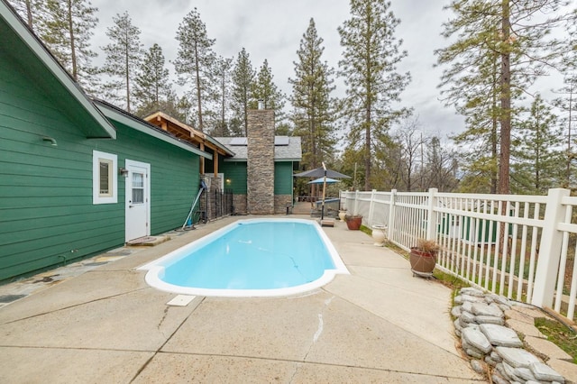 view of swimming pool featuring a patio