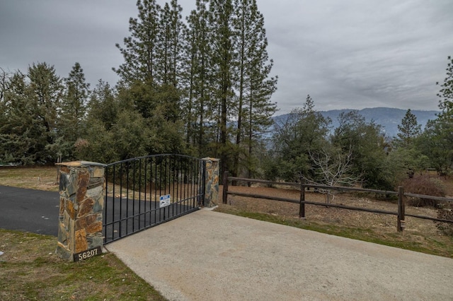 view of gate featuring a mountain view