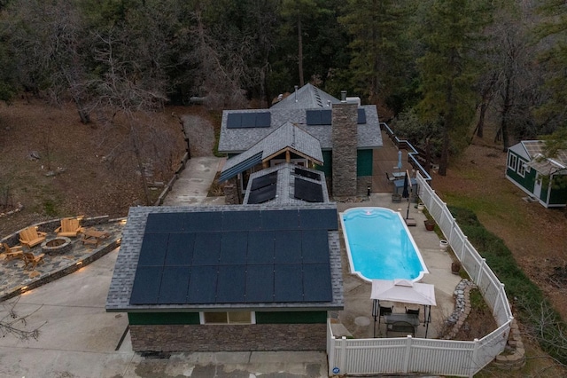 view of swimming pool with a gazebo and an outdoor fire pit