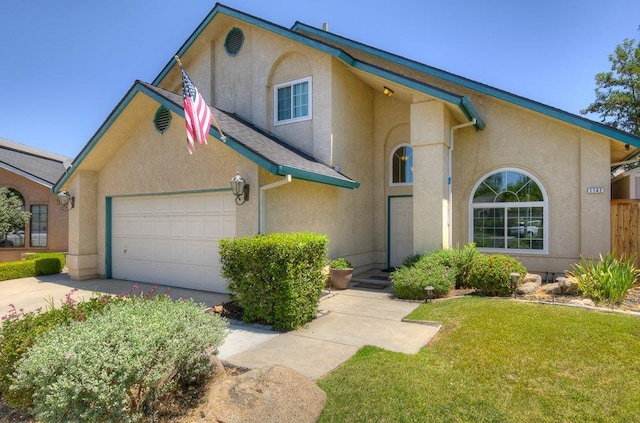 view of front of property with a garage and a front yard