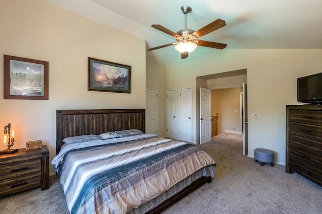 carpeted bedroom with ceiling fan and lofted ceiling