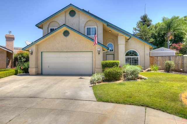 1147 N Carey Ave, Clovis, CA 93611 - mediterranean / spanish-style house featuring concrete driveway, an attached garage, and stucco siding