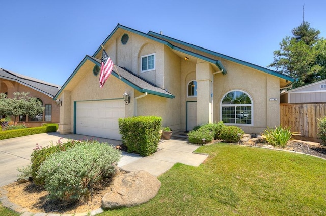 view of front of property featuring a garage and a front yard