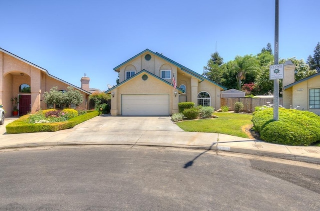 view of front of home with a garage and a front lawn