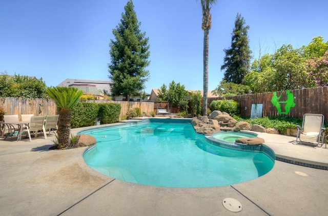 1147 N Carey Ave, Clovis, CA 93611 - view of pool with a patio area, a fenced backyard, and a pool with connected hot tub