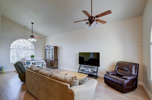 1147 N Carey Ave, Clovis, CA 93611 - living room featuring ceiling fan, light wood-type flooring, baseboards, and high vaulted ceiling