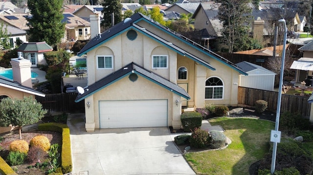 1147 N Carey Ave, Clovis, CA 93611 - view of front facade with concrete driveway, stucco siding, a residential view, and an attached garage