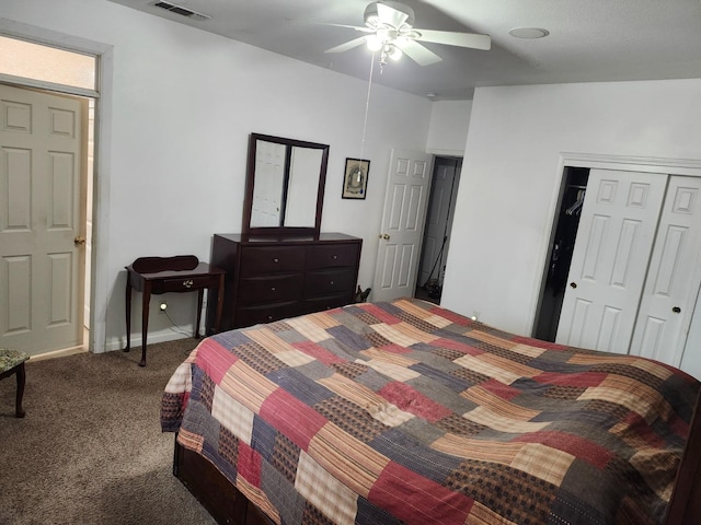 carpeted bedroom with ceiling fan and a closet