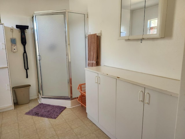 30684 Obanion Ln, Prather, CA 93651 - bathroom featuring a stall shower, tile patterned floors, and vanity