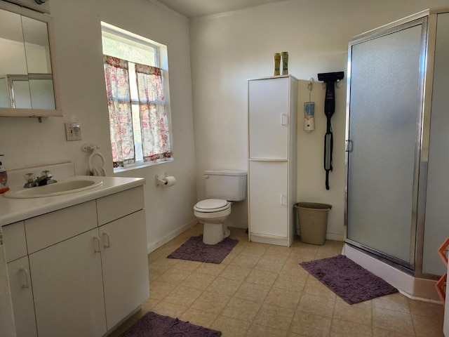 full bathroom with a shower stall, vanity, toilet, tile patterned floors, and baseboards