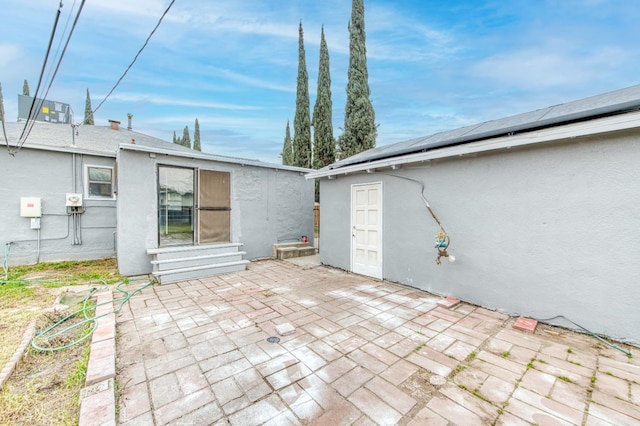 view of patio featuring a storage shed