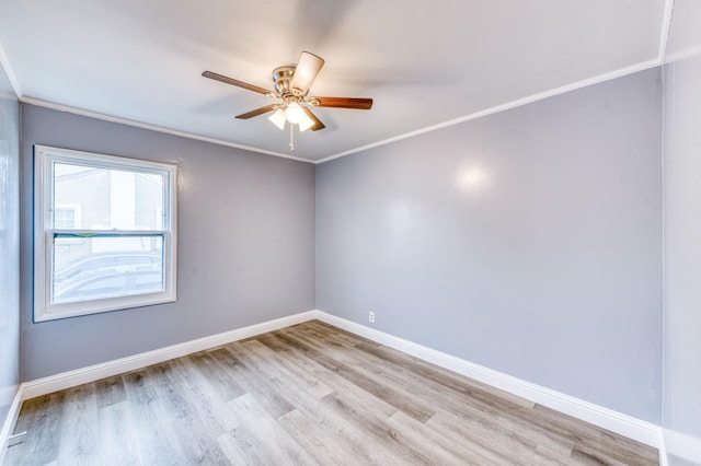 spare room featuring crown molding, ceiling fan, and light hardwood / wood-style floors