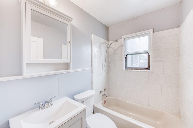 full bathroom featuring vanity, toilet, and tiled shower / bath