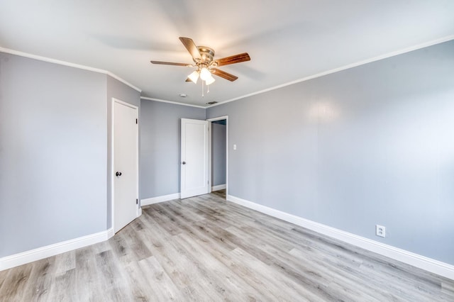 unfurnished room with ornamental molding, ceiling fan, and light wood-type flooring