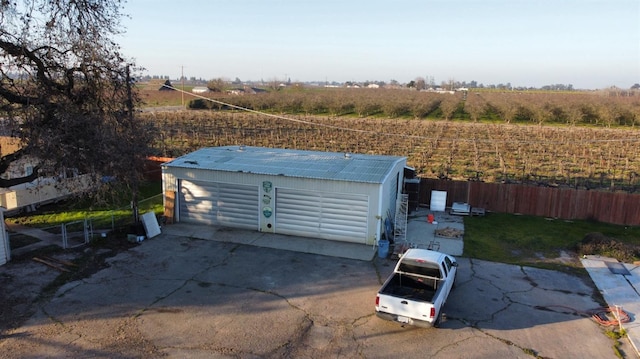 birds eye view of property featuring a rural view