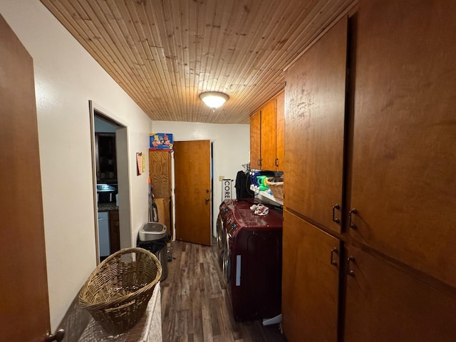 laundry room with cabinets, separate washer and dryer, dark hardwood / wood-style floors, and wooden ceiling