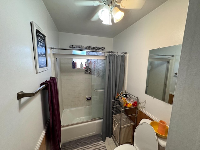 bathroom with ceiling fan, tiled shower / bath combo, and toilet